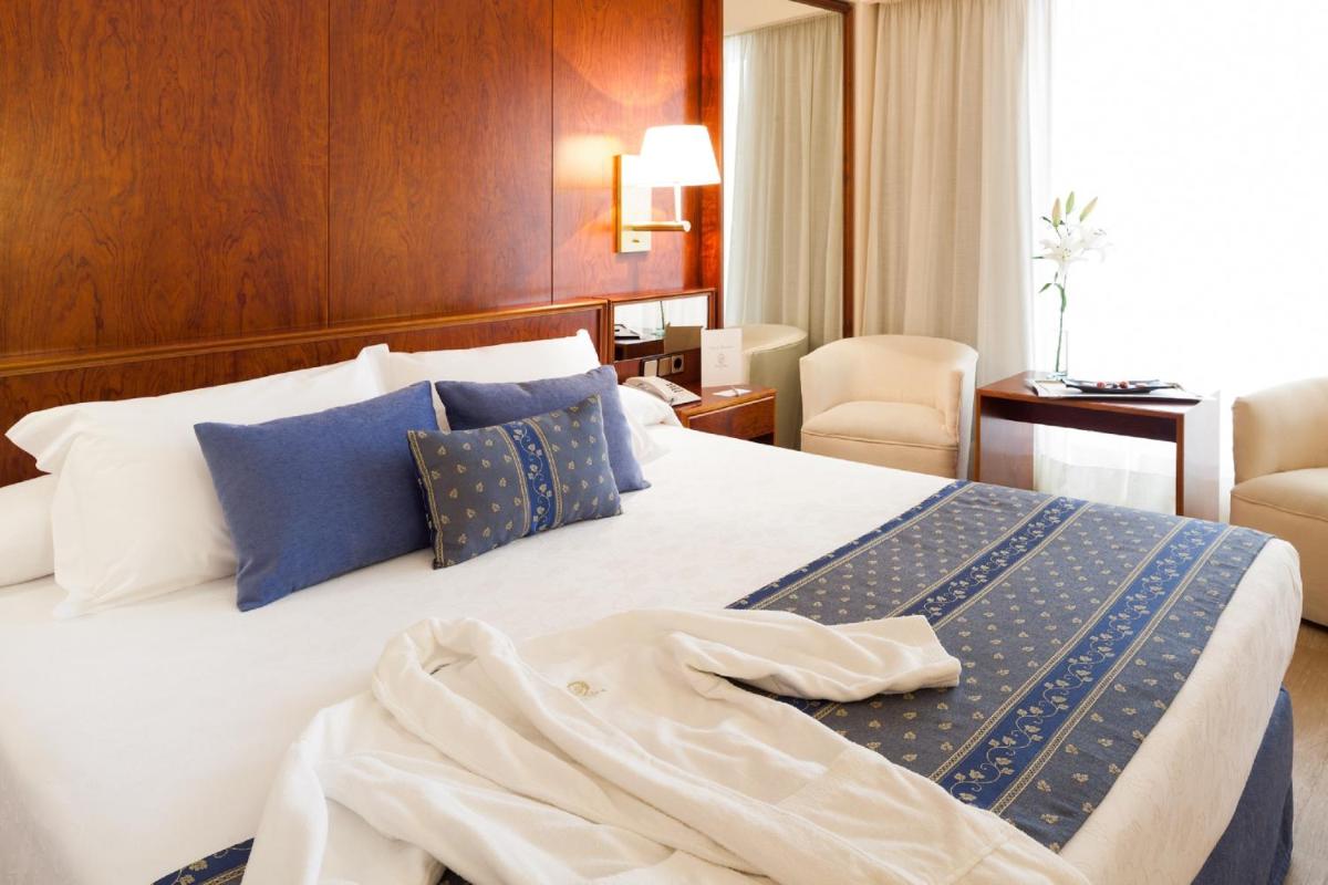 Cama o camas de una habitación en Hotel Royal Plaza