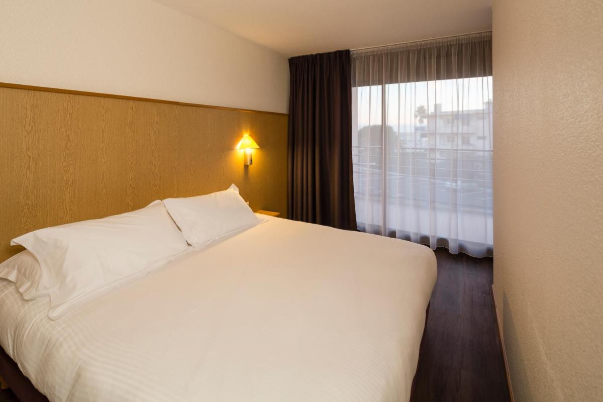 Un ou plusieurs lits dans un hébergement de l'établissement Thalazur Antibes - Résidence & Spa