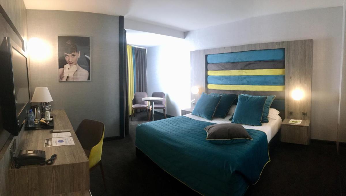 Un ou plusieurs lits dans un hébergement de l'établissement Hotel Palladia