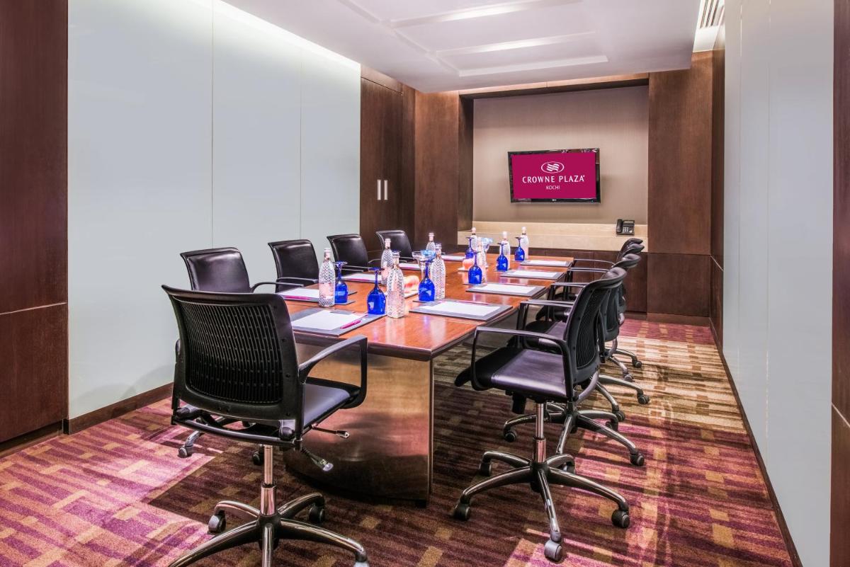 a conference room with a long table and chairs at Crowne Plaza Kochi by IHG in Cochin