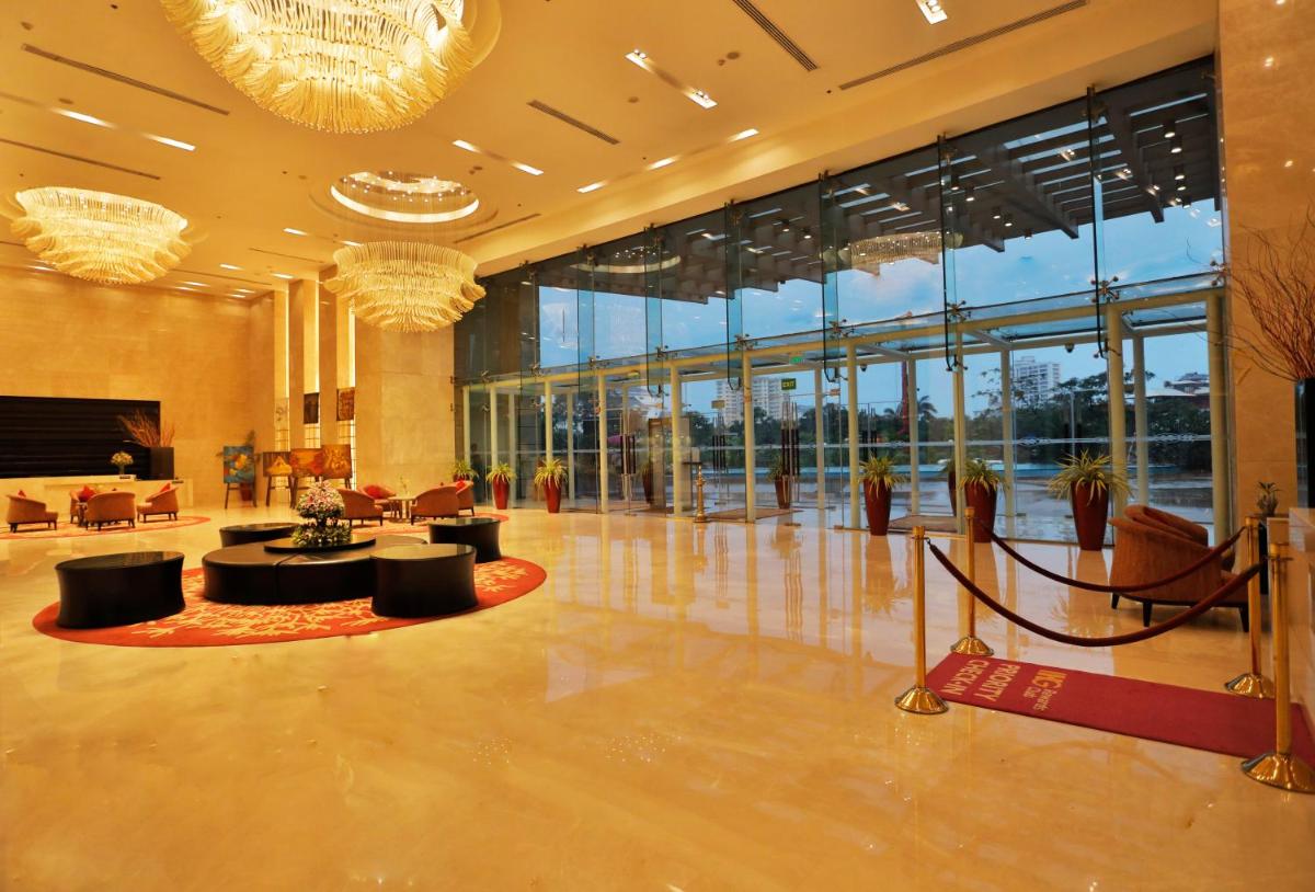 a lobby of a hotel with a lot of windows at Crowne Plaza Kochi by IHG in Cochin