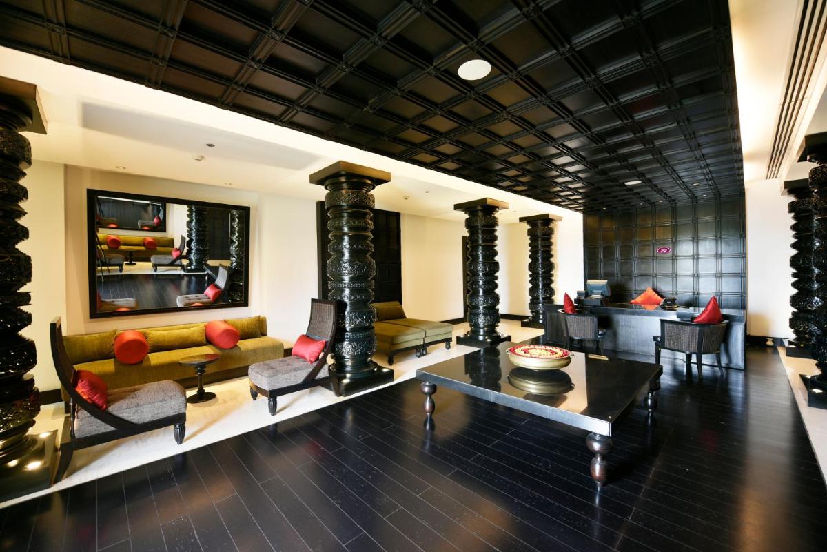 a living room with a couch and a table at Crowne Plaza Kochi by IHG in Cochin