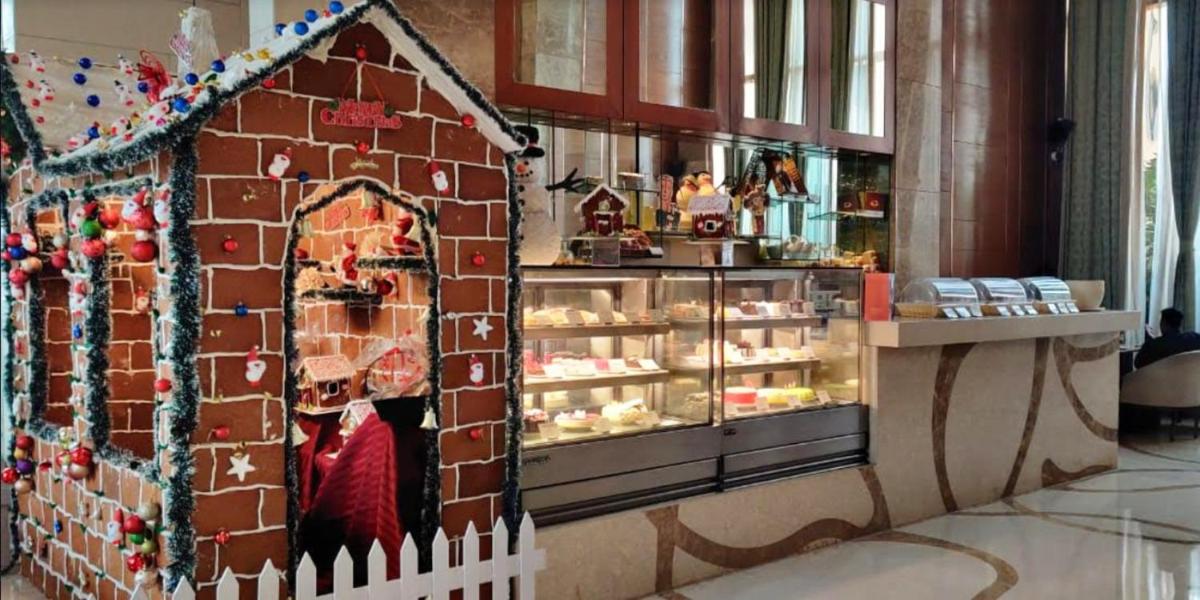 a gingerbread house is shown in a store at Crowne Plaza New Delhi Okhla by IHG in New Delhi