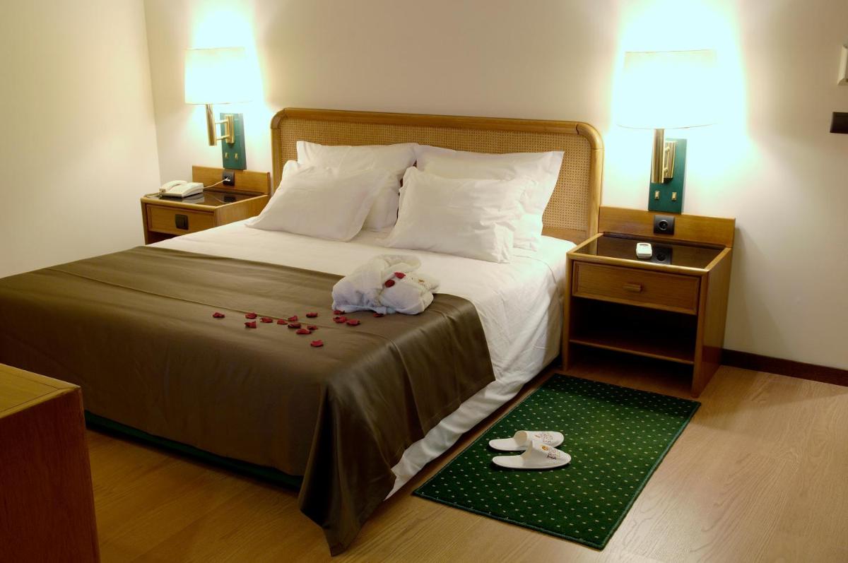 Uma cama ou camas num quarto em Palace Hotel & Spa - Termas de Sao Vicente