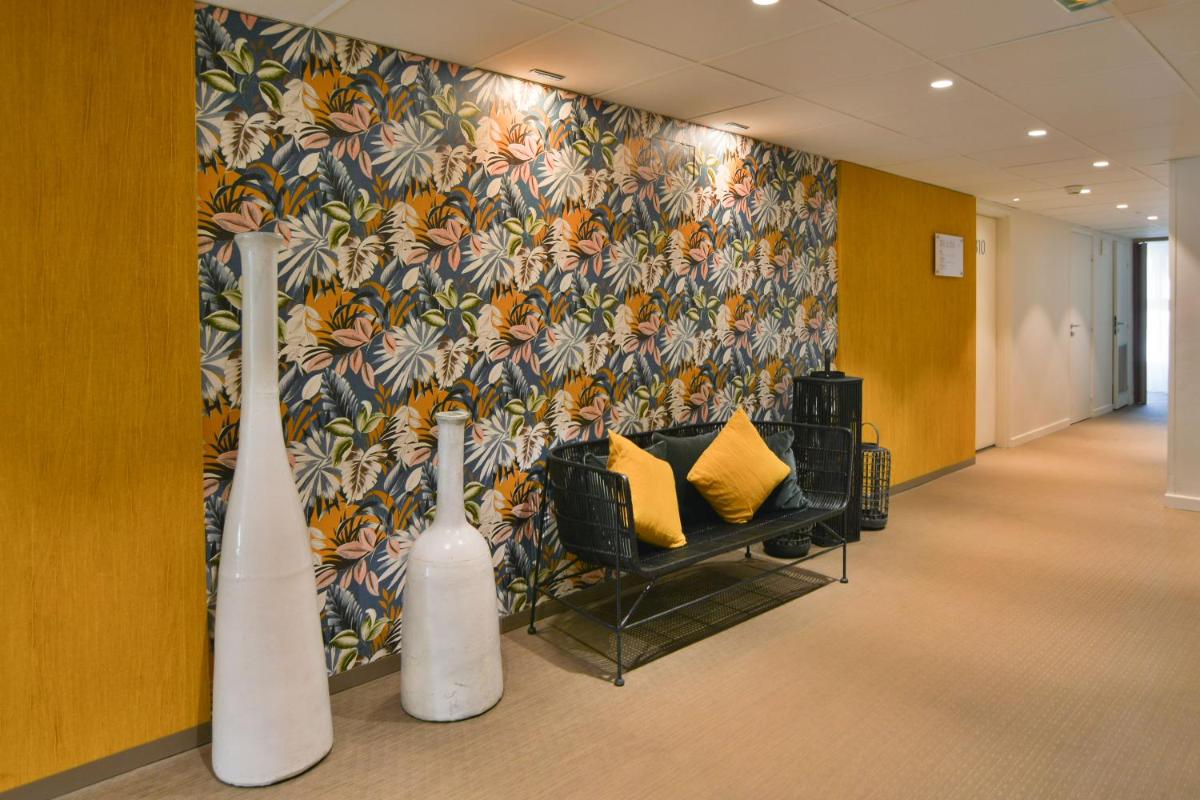 Coin salon dans l'établissement Hôtel Les Corallines - Thalasso & Resort
