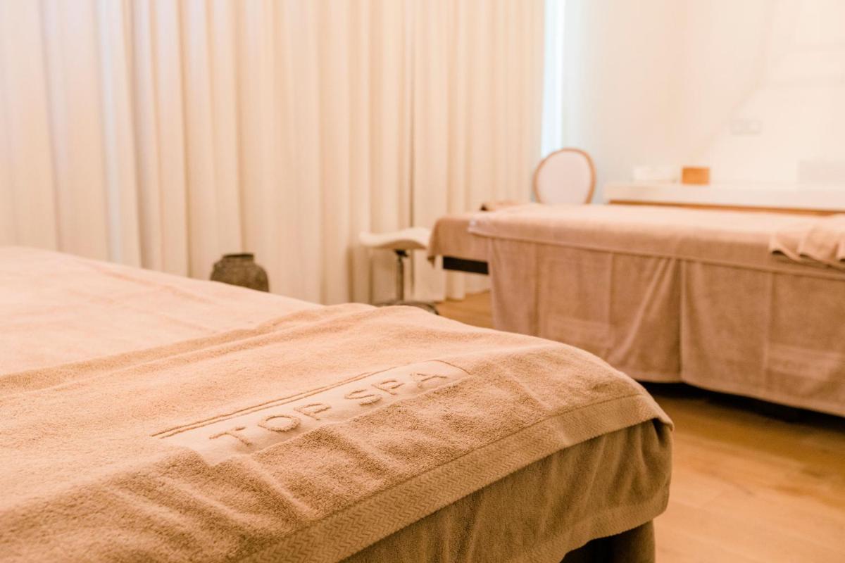 Uma cama ou camas num quarto em Royal Obidos Scenic Resort