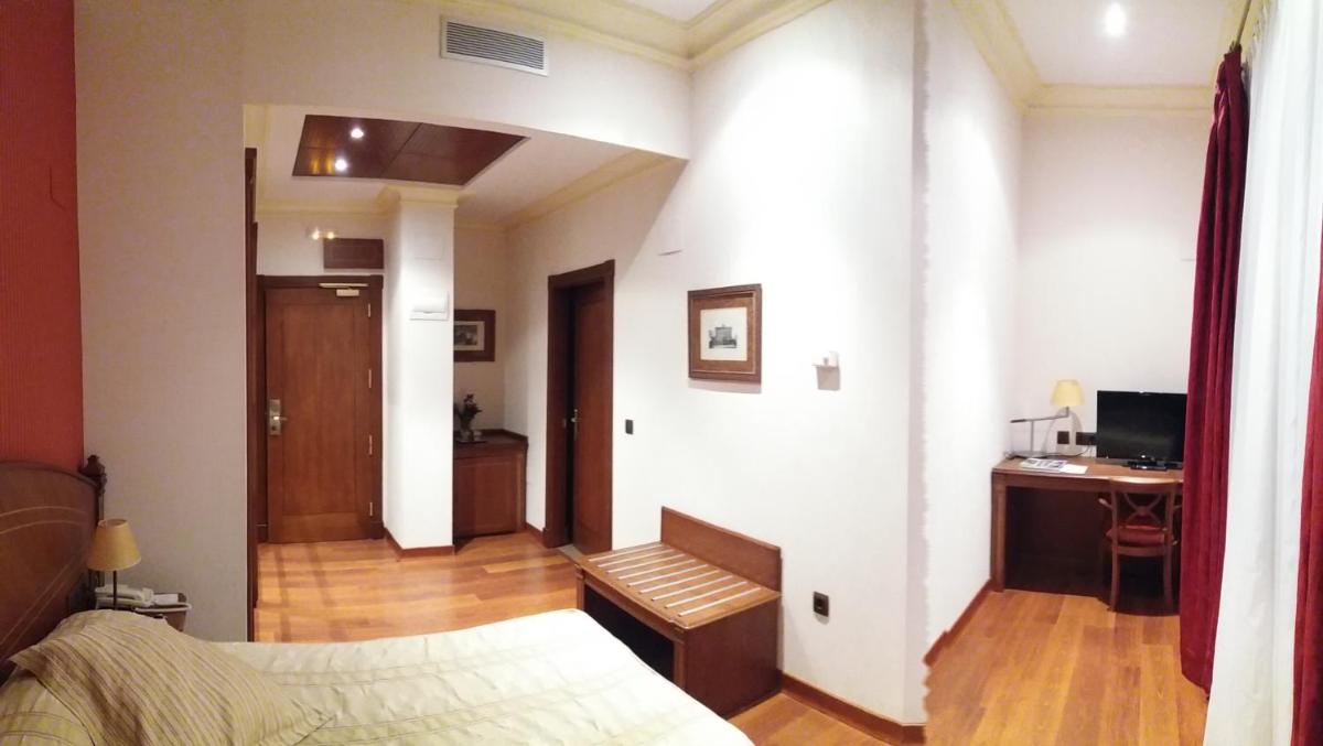Cama o camas de una habitación en Hotel Palacio de la Magdalena