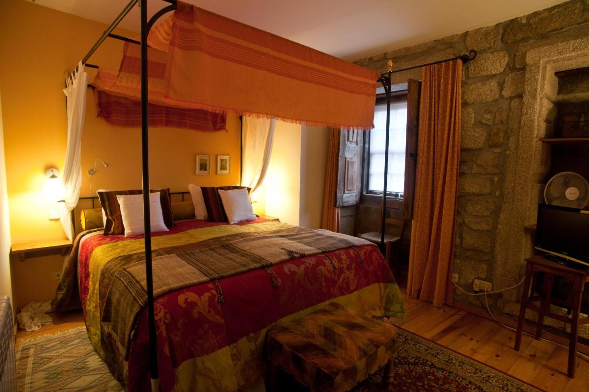 Uma cama ou camas num quarto em Hotel Rural Quinta da Geia