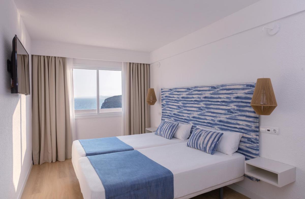 Cama o camas de una habitación en Blau Punta Reina