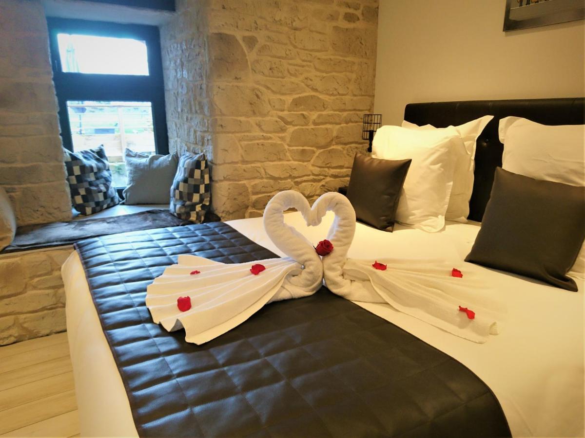 Un ou plusieurs lits dans un hébergement de l'établissement Le Moulin d'Oscar & Spa - Mulhouse Nord
