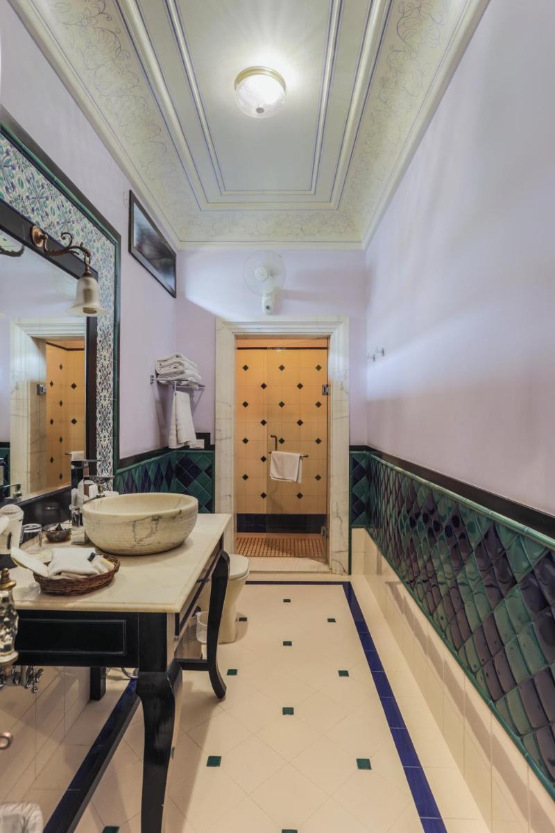 a bathroom with a sink and a large mirror at Royal Heritage Haveli - By Leisure Hotels in Jaipur
