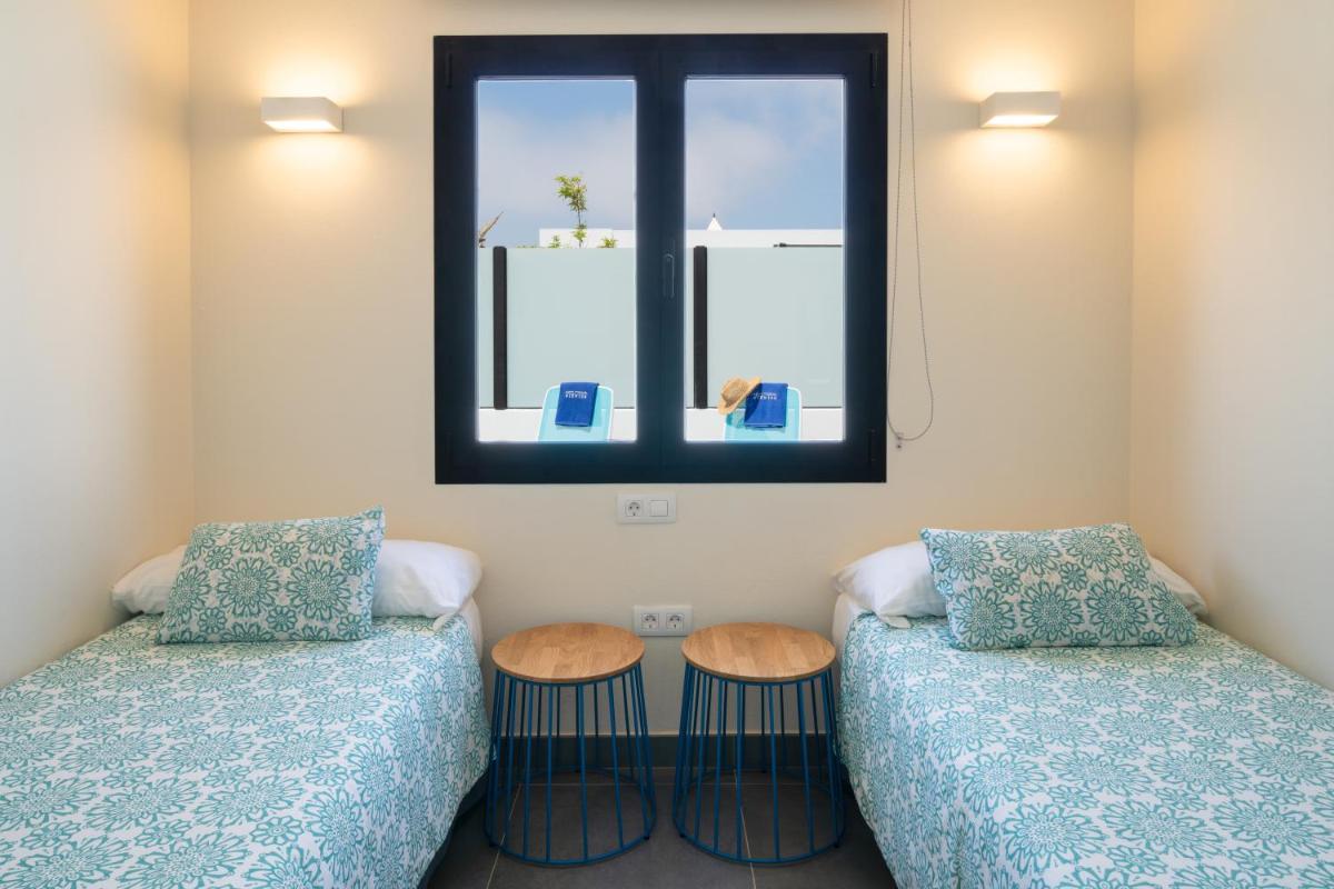 Cama o camas de una habitación en Relaxia Lanzasur Club - Aqualava Water Park