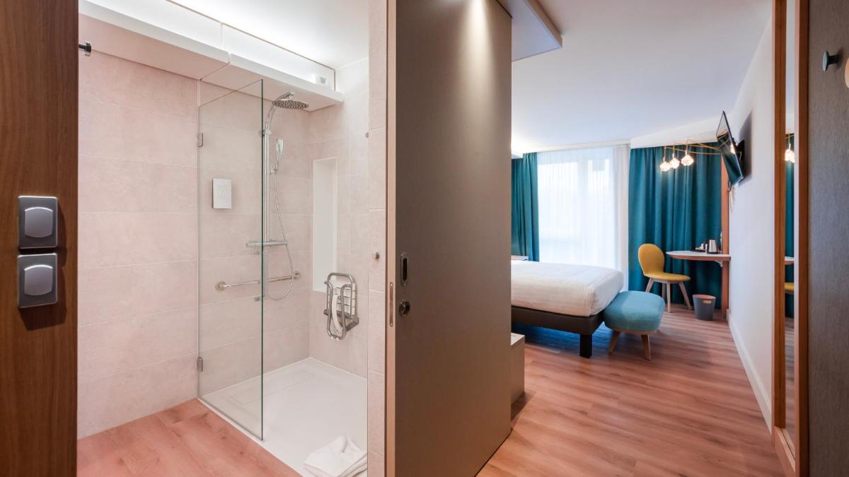 Un ou plusieurs lits dans un hébergement de l'établissement voco Strasbourg Centre - The Garden by IHG