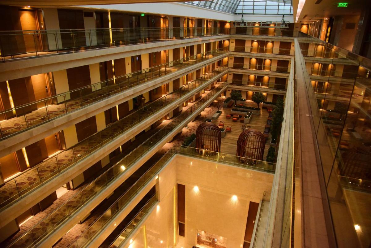 an overhead view of a large building with a balcony at Holiday Inn Jaipur City Centre by IHG in Jaipur an overhead view of a large building with a balcony at Holiday Inn Jaipur City Centre by IHG in Jaipur