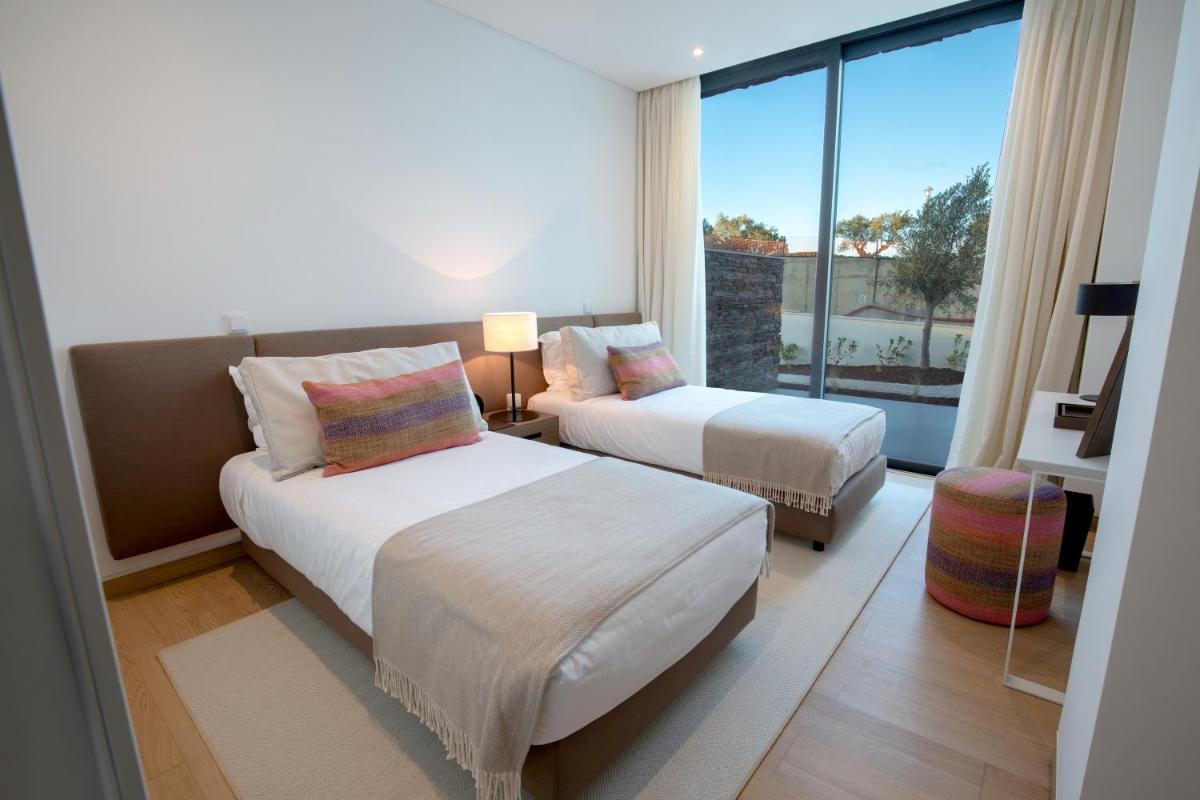 Uma cama ou camas num quarto em Monte Rei Golf & Country Club