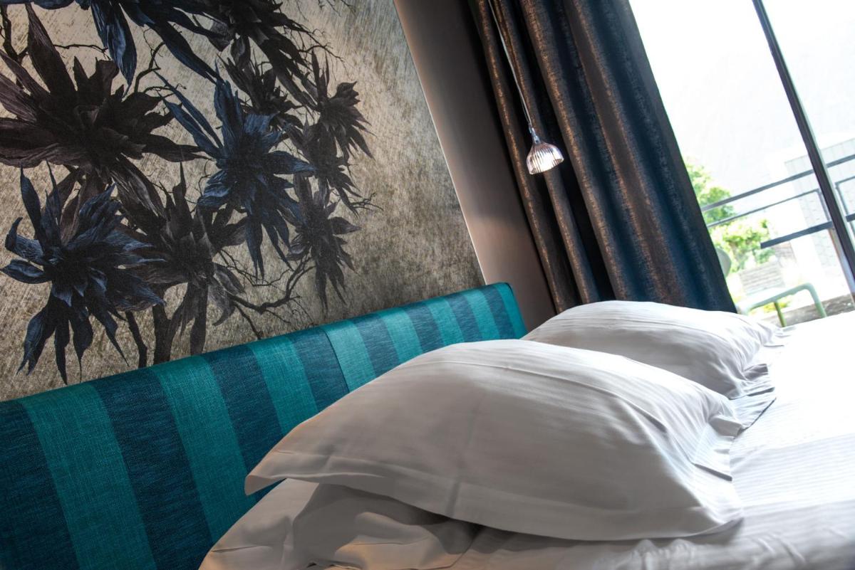 Un ou plusieurs lits dans un hébergement de l'établissement Best Western Aquakub
