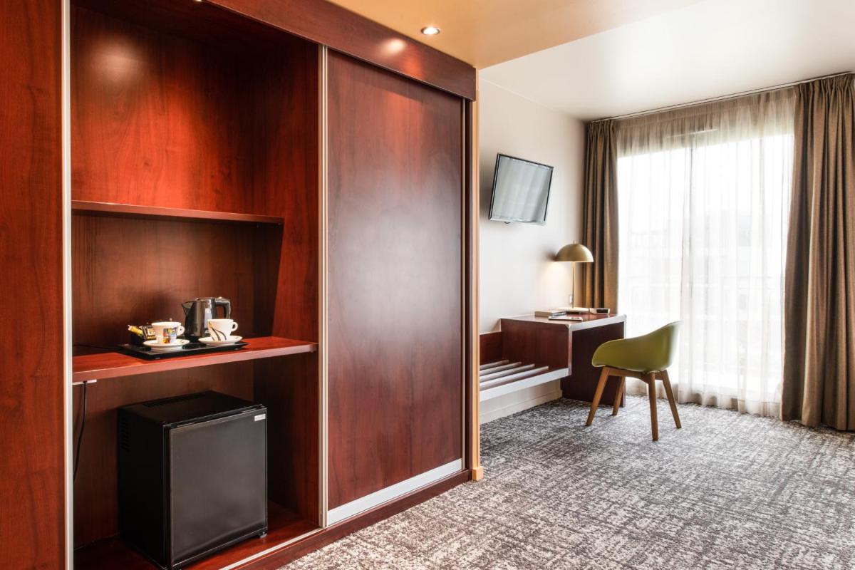 Télévision ou salle de divertissement dans l'établissement Best Western Aquakub