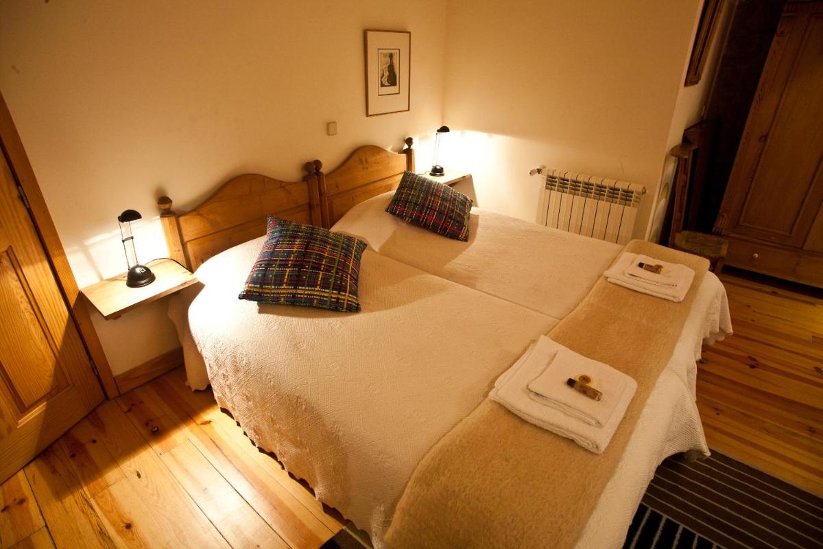 Uma cama ou camas num quarto em Hotel Rural Quinta da Geia