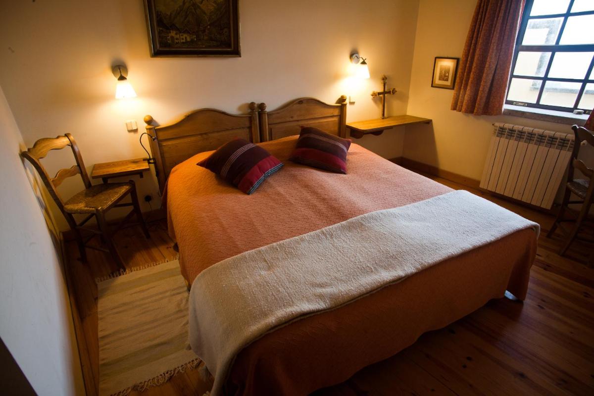 Uma cama ou camas num quarto em Hotel Rural Quinta da Geia