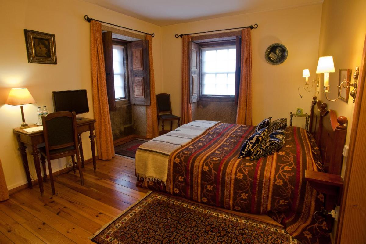 Uma cama ou camas num quarto em Hotel Rural Quinta da Geia