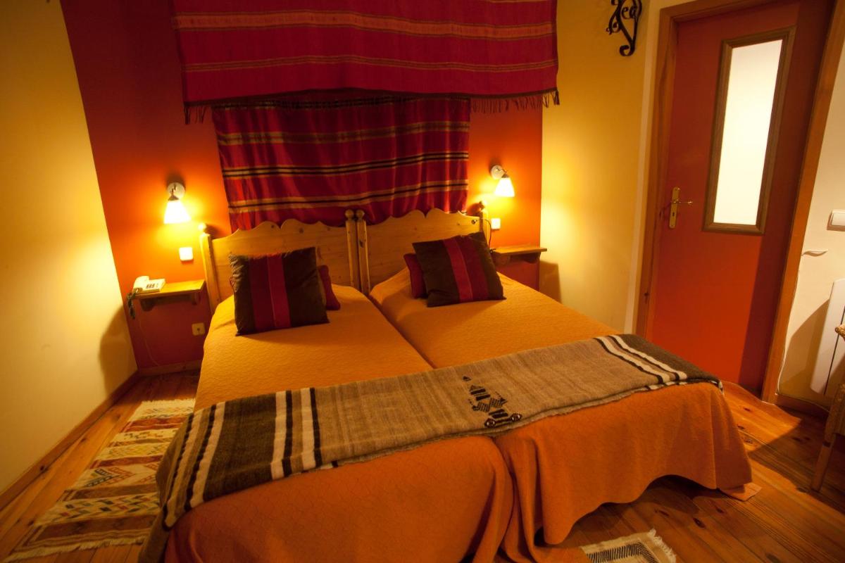Uma cama ou camas num quarto em Hotel Rural Quinta da Geia