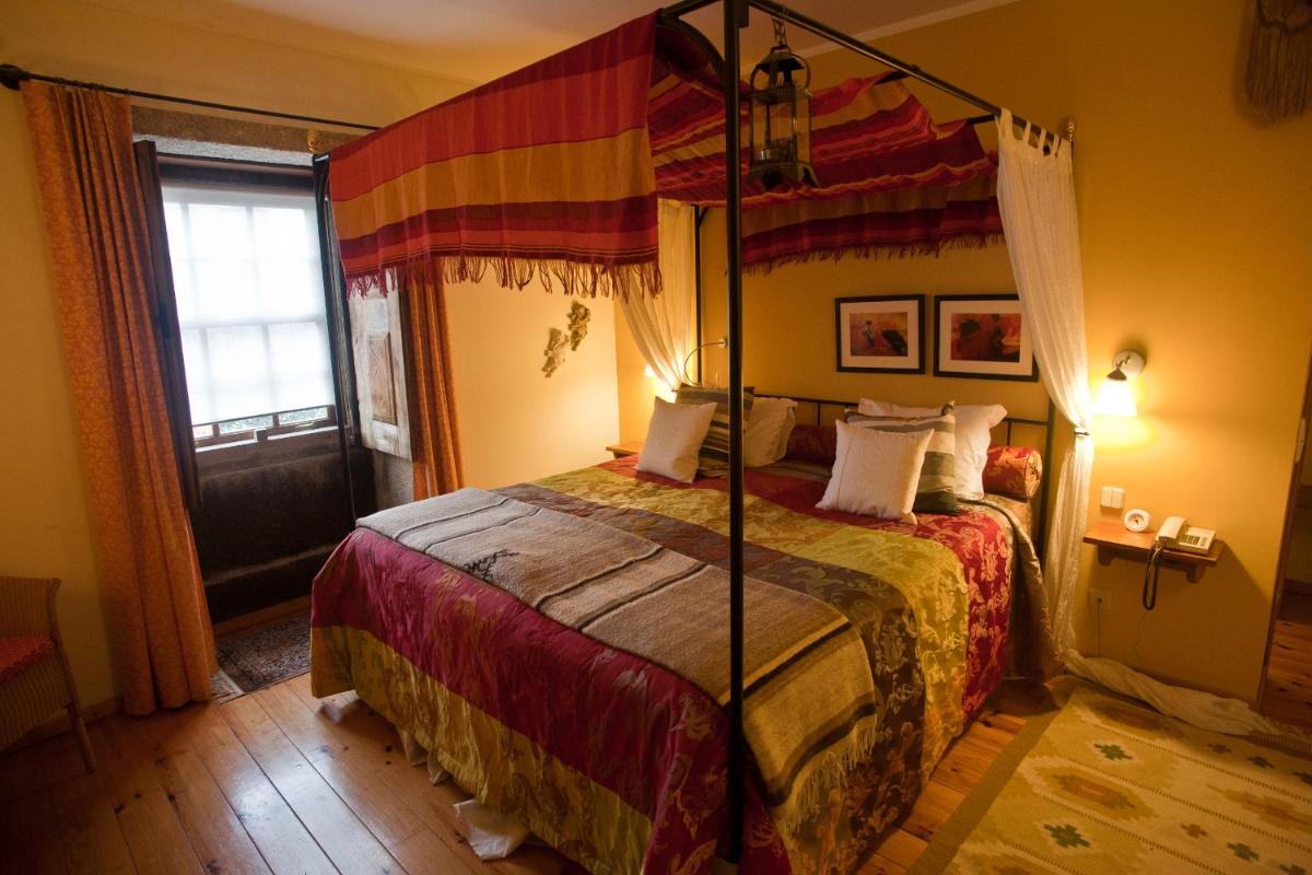 Uma cama ou camas num quarto em Hotel Rural Quinta da Geia