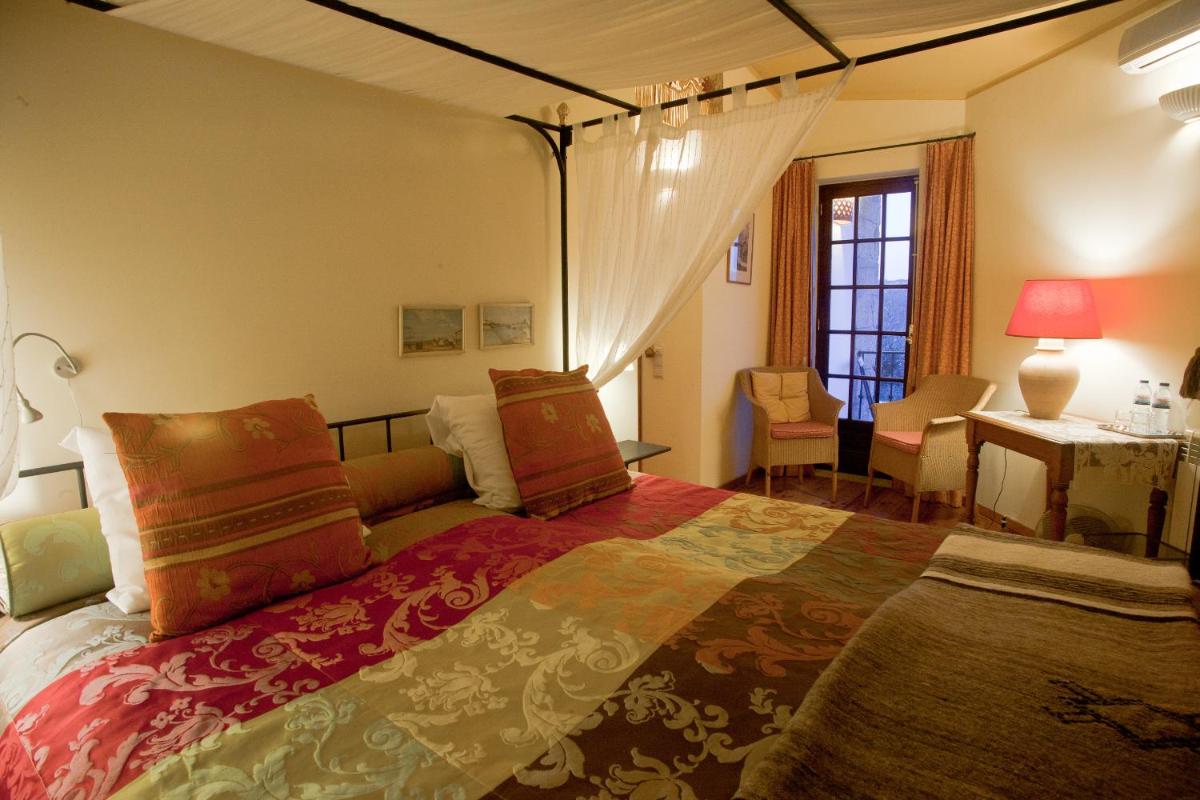 Uma cama ou camas num quarto em Hotel Rural Quinta da Geia