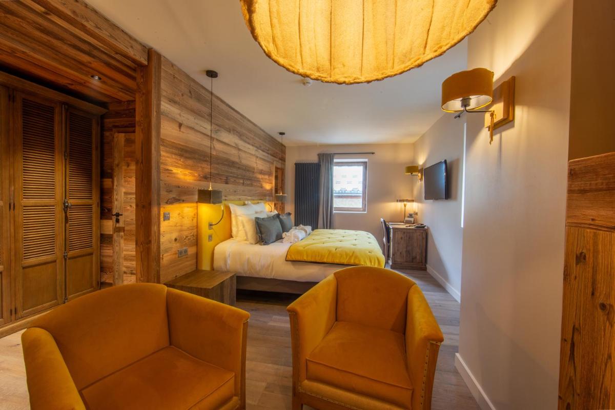 Un ou plusieurs lits dans un hébergement de l'établissement Hotel Le V de Vaujany