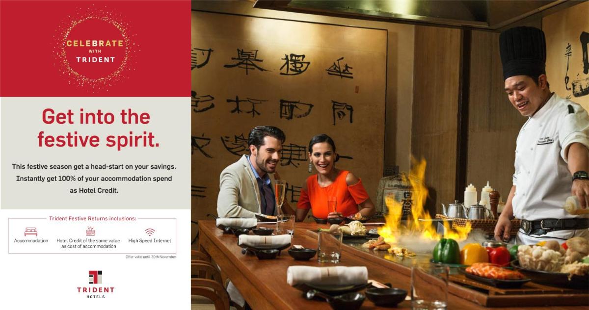 a group of three men in a restaurant preparing food at Trident Nariman Point in Mumbai a group of three men in a restaurant preparing food at Trident Nariman Point in Mumbai