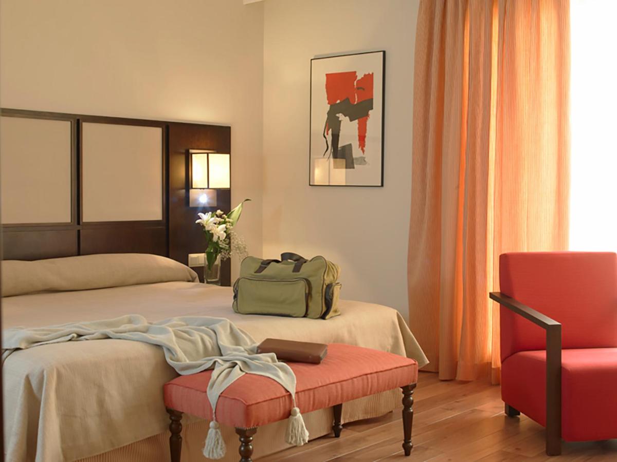 Cama o camas de una habitación en Hotel Isla de La Garena