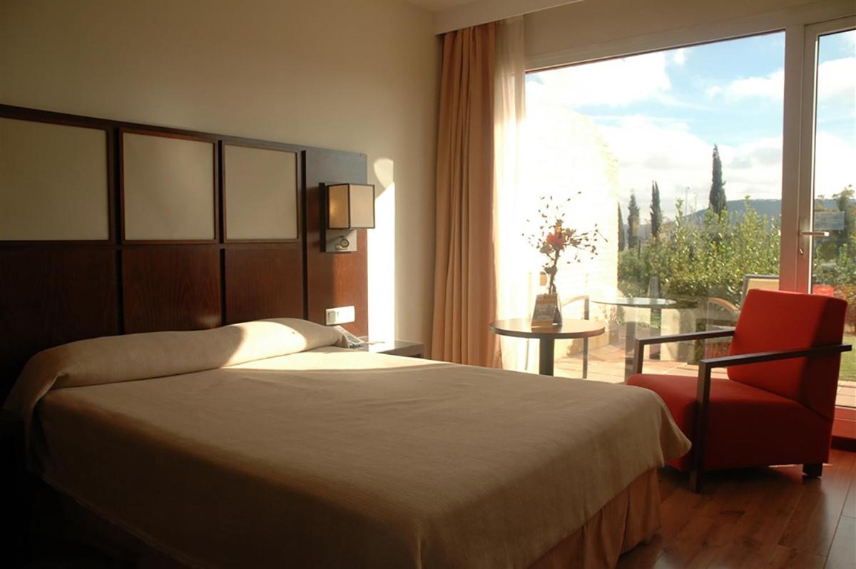 Cama o camas de una habitación en Hotel Isla de La Garena