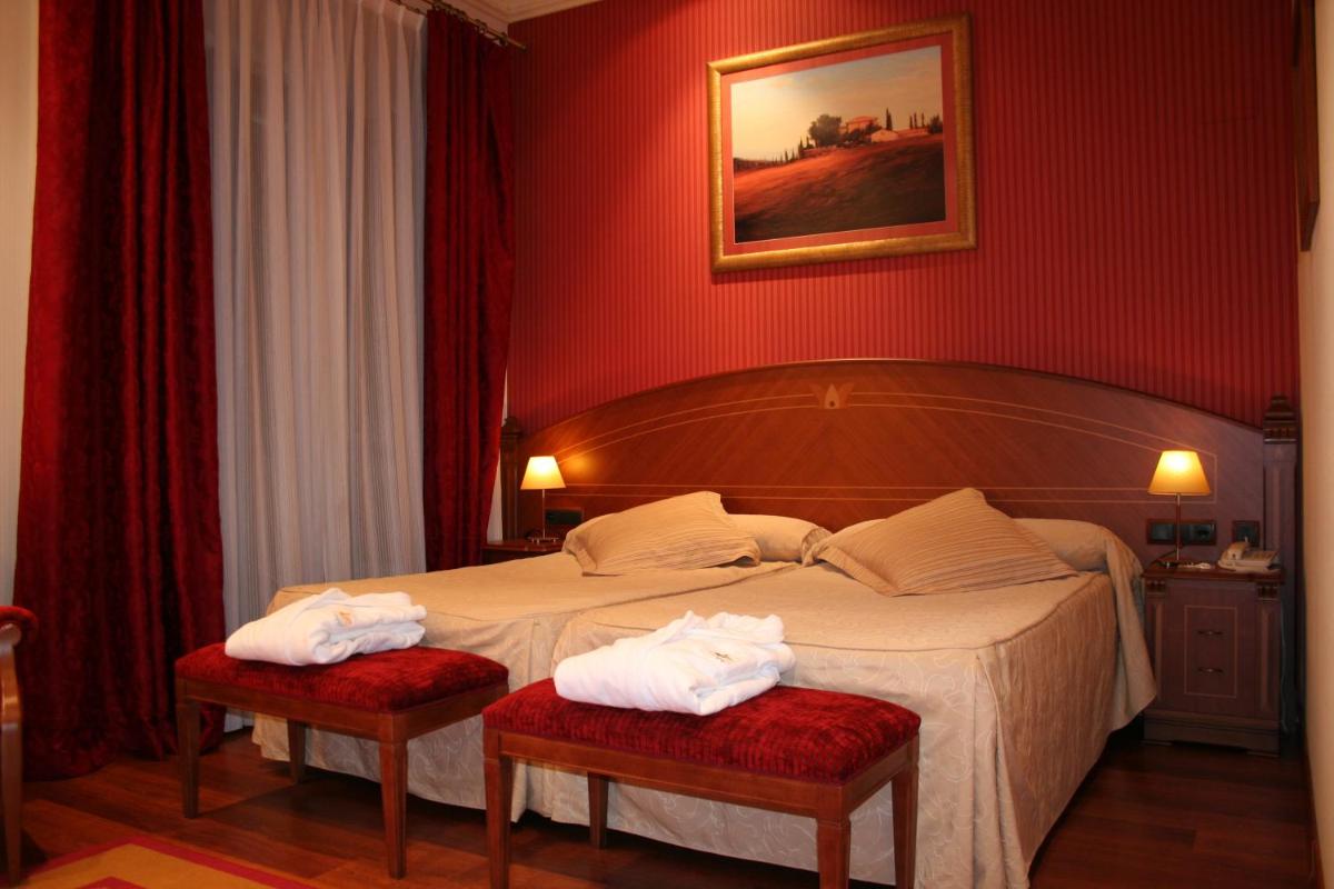 Cama o camas de una habitación en Hotel Palacio de la Magdalena