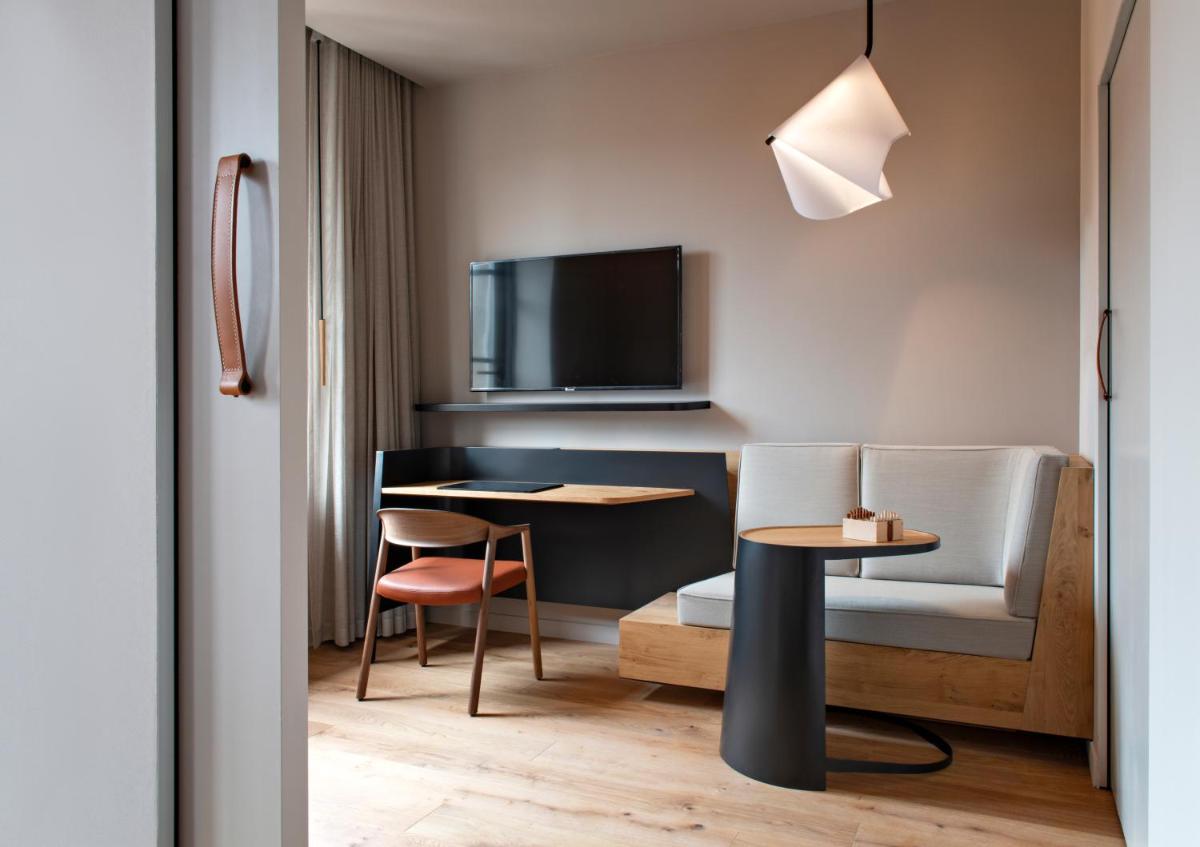 Télévision ou salle de divertissement dans l'établissement Hotel Les Haras