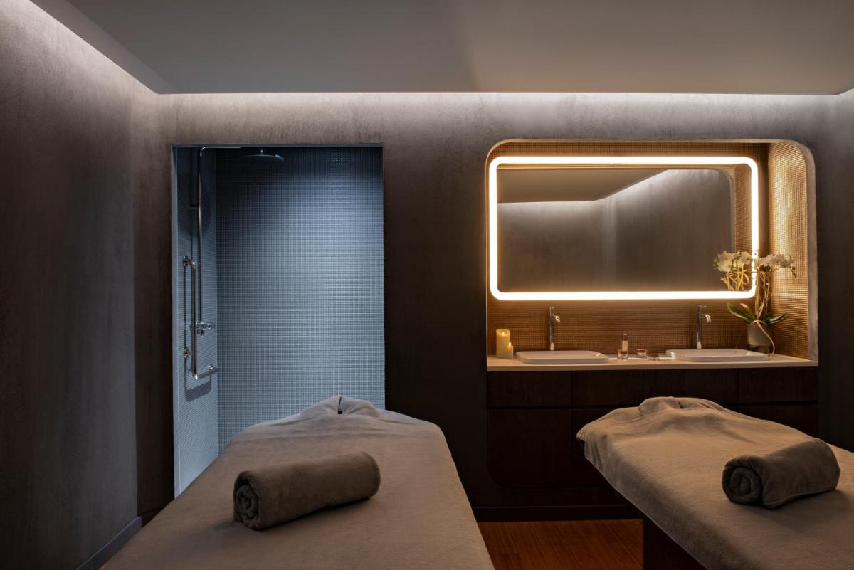 Un ou plusieurs lits dans un hébergement de l'établissement Hotel Les Haras