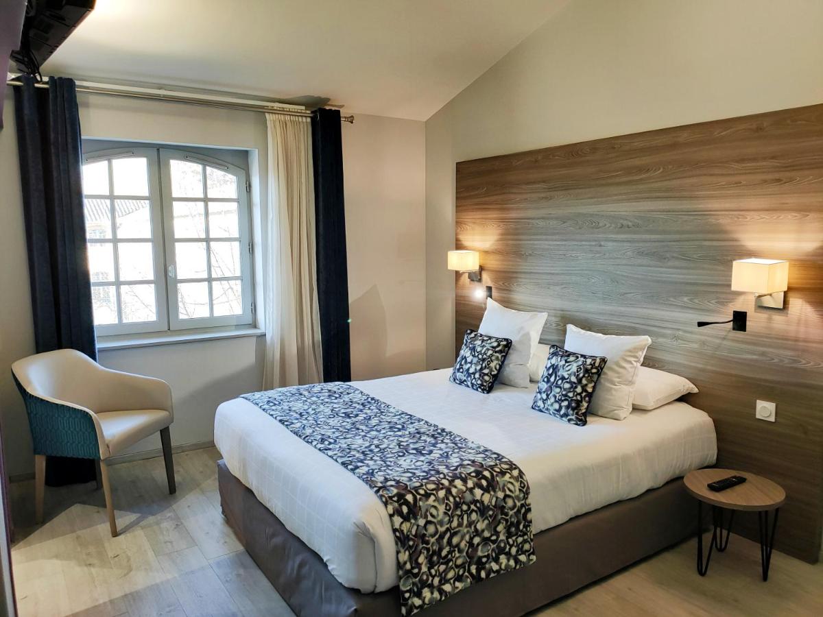 Un ou plusieurs lits dans un hébergement de l'établissement Abbaye des Capucins Spa & Resort