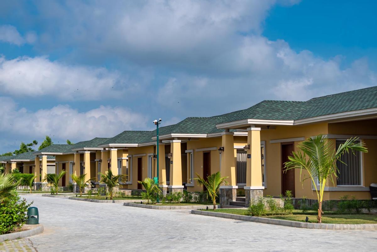 a row of houses at a resort at Hawthorn Suites by Wyndham Dwarka in Dwarka a row of houses at a resort at Hawthorn Suites by Wyndham Dwarka in Dwarka