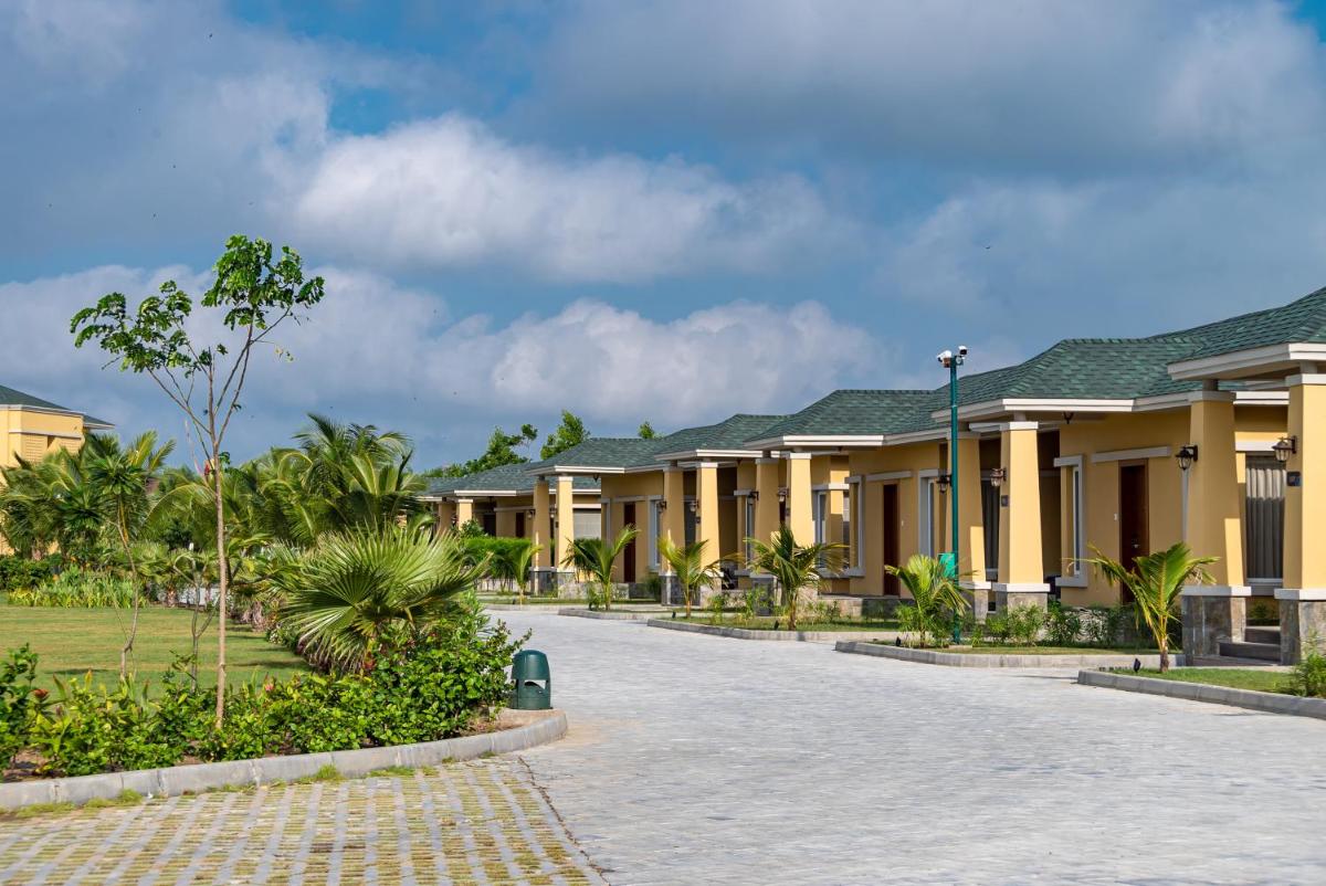 a row of houses at a resort at Hawthorn Suites by Wyndham Dwarka in Dwarka a row of houses at a resort at Hawthorn Suites by Wyndham Dwarka in Dwarka