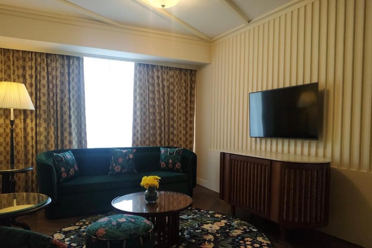 a living room with a couch and a tv at Blue Diamond Pune IHCL SeleQtions in Pune