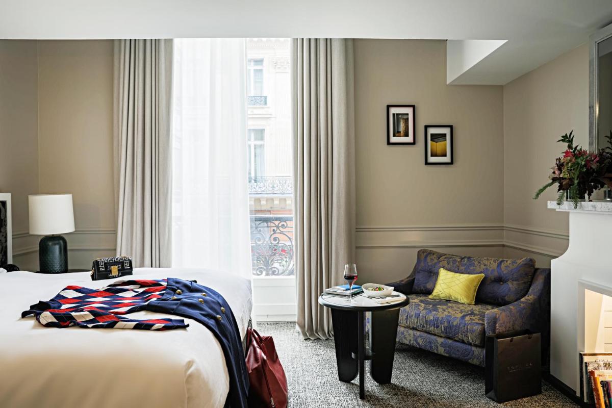 Un ou plusieurs lits dans un hébergement de l'établissement Sofitel Le Scribe Paris Opera