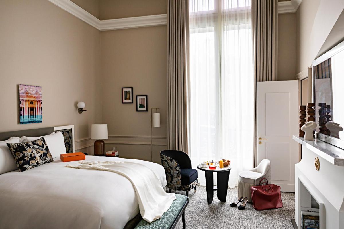 Un ou plusieurs lits dans un hébergement de l'établissement Sofitel Le Scribe Paris Opera