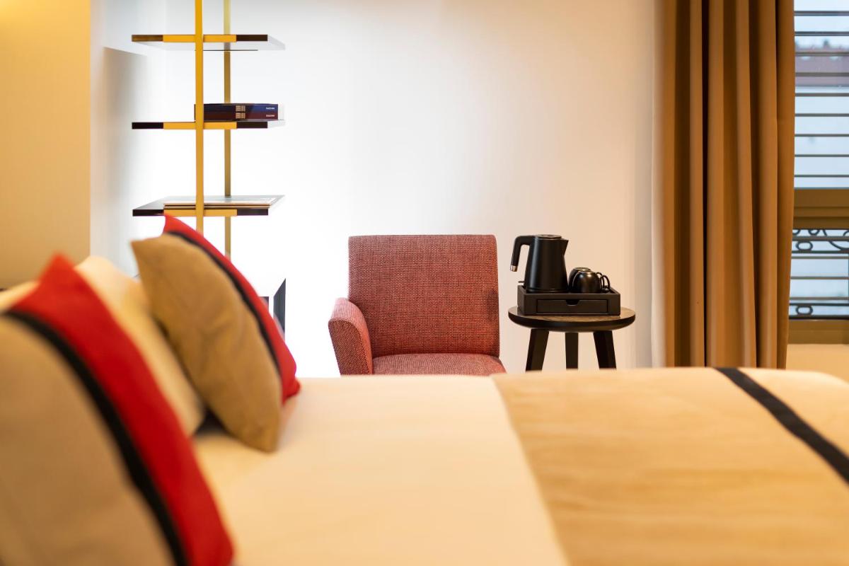 Un ou plusieurs lits dans un hébergement de l'établissement HÔTEL & SPA Panorama 360