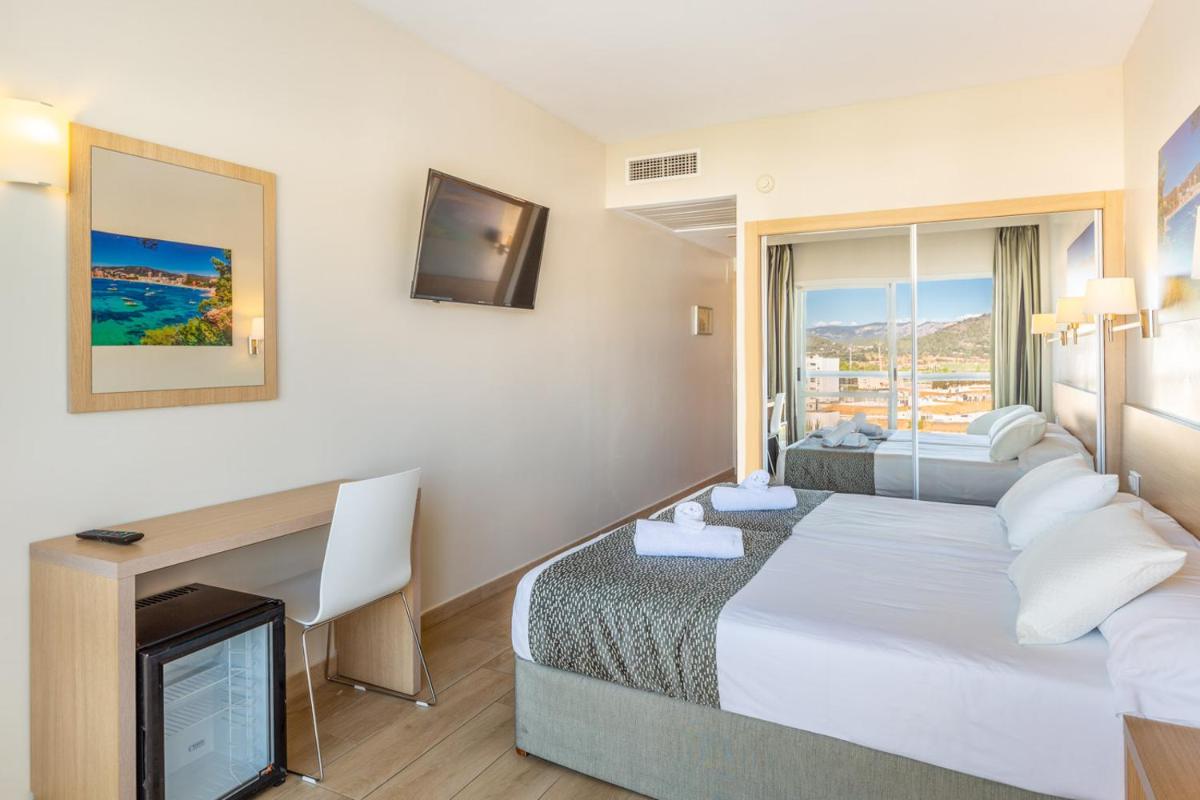 Cama o camas de una habitación en Hotel Samos