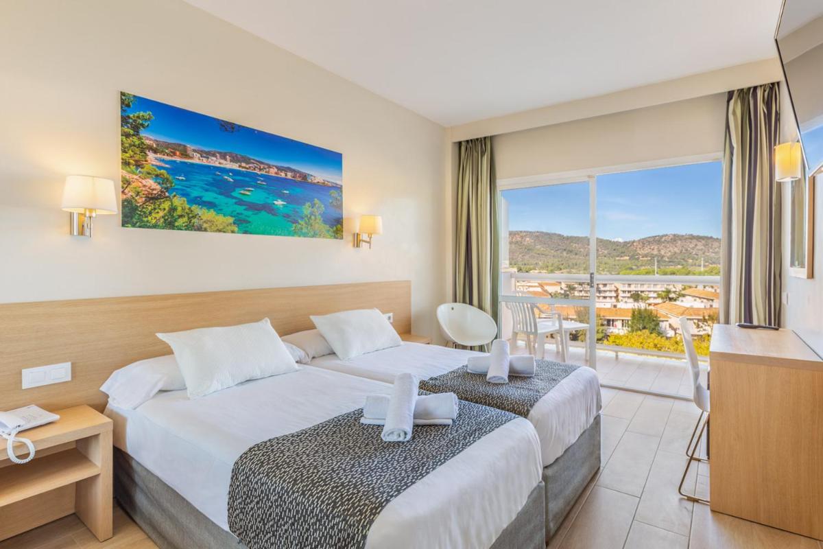 Cama o camas de una habitación en Hotel Samos