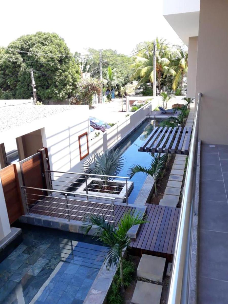Charming apartment in Flic en Flac with shared pool - Housity