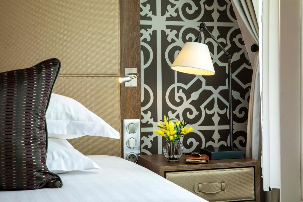 Un ou plusieurs lits dans un hébergement de l'établissement Hotel Phileas Lazare & Spa - Opera