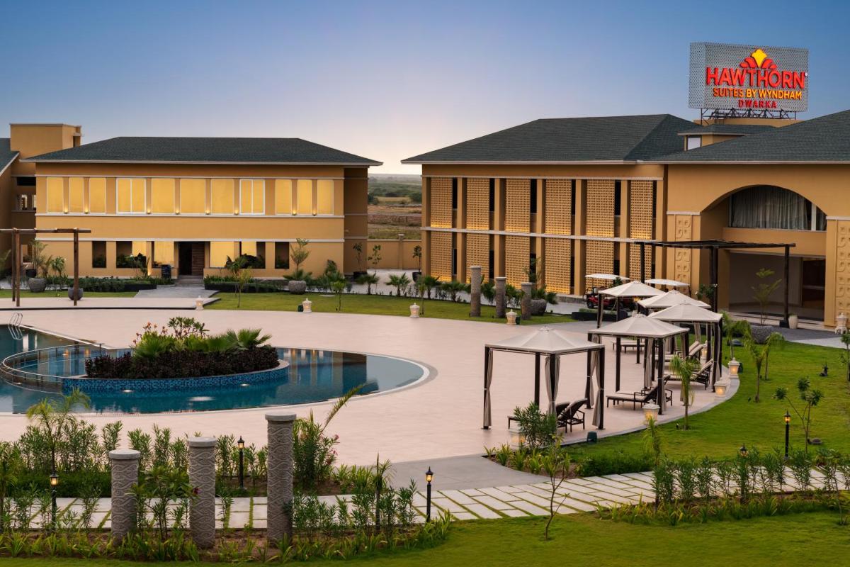 a rendering of a resort with a swimming pool at Hawthorn Suites by Wyndham Dwarka in Dwarka a rendering of a resort with a swimming pool at Hawthorn Suites by Wyndham Dwarka in Dwarka