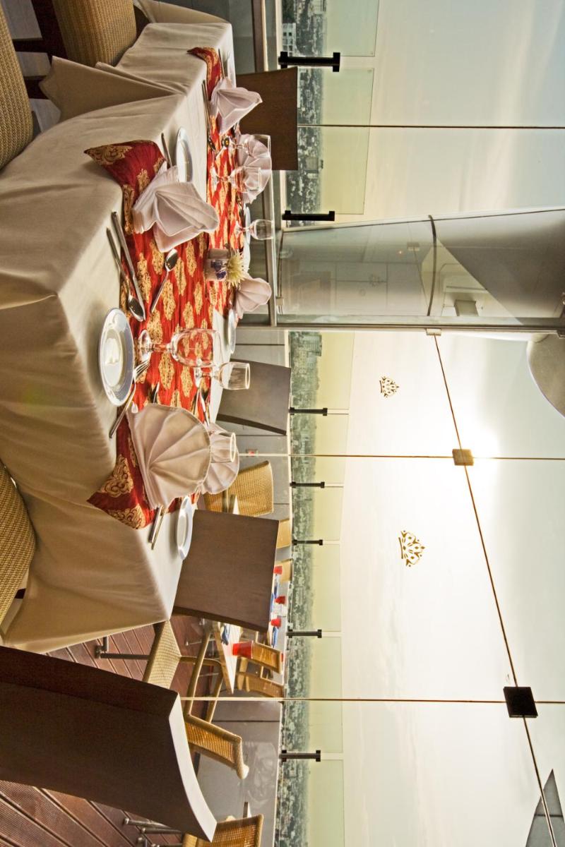 a row of tables and chairs in a room at The Accord Metropolitan in Chennai