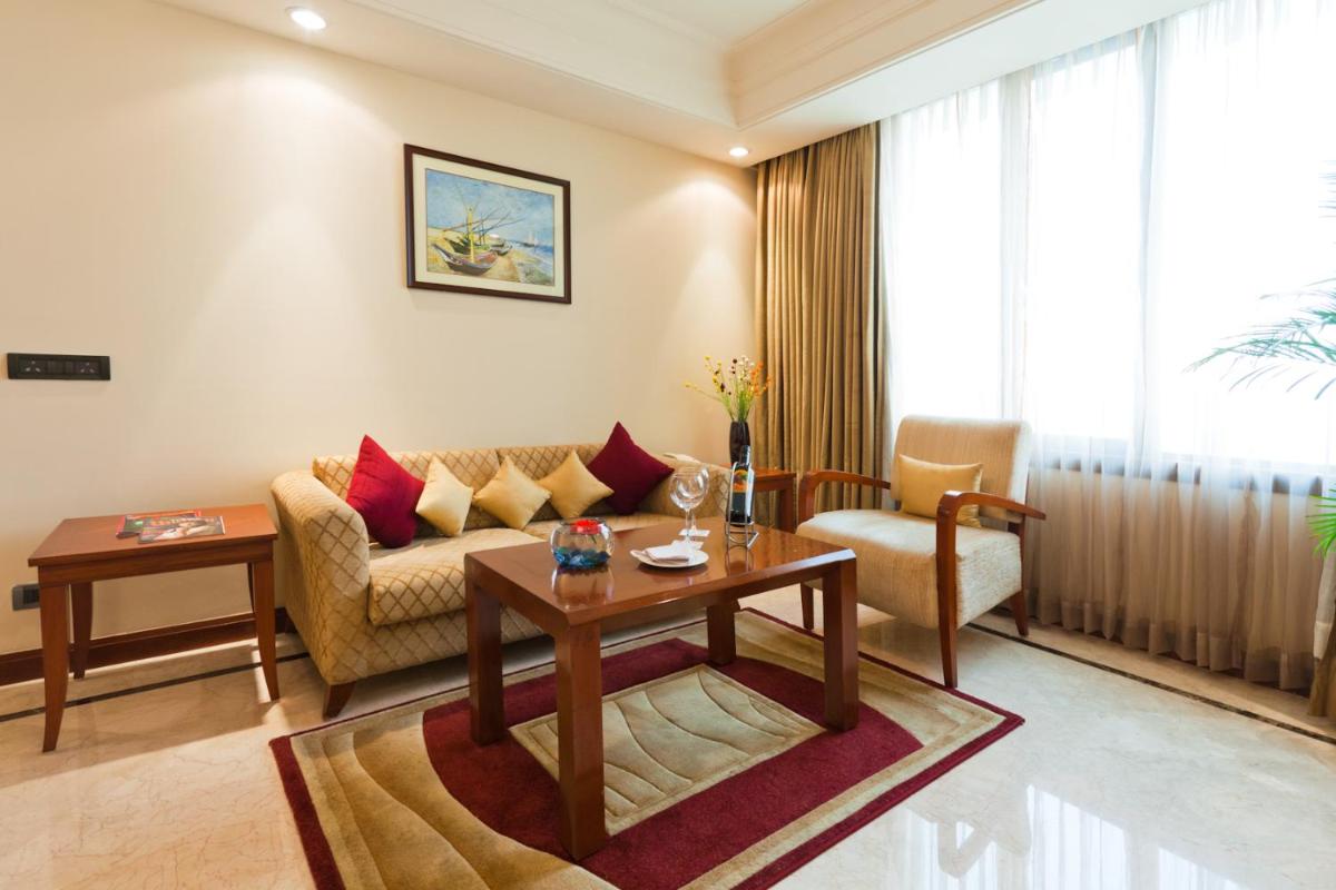 a living room with a couch and a table at The Accord Metropolitan in Chennai