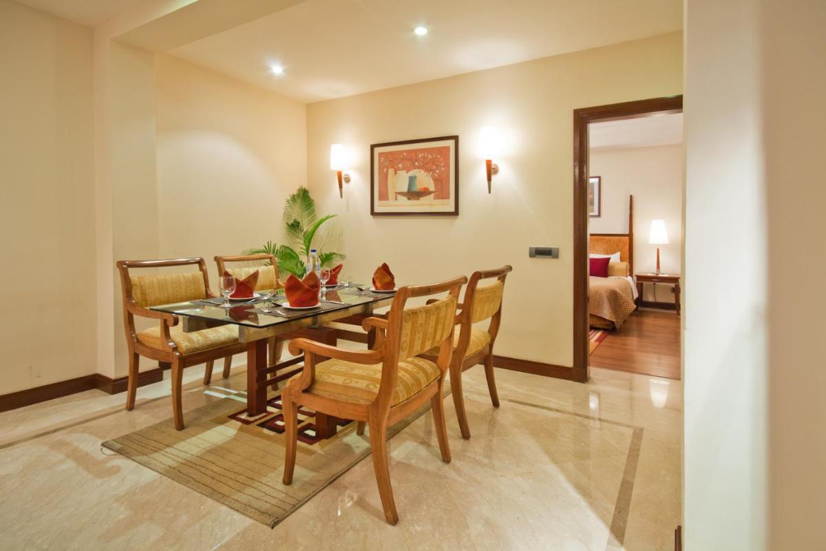 a dining room with a table and chairs at The Accord Metropolitan in Chennai