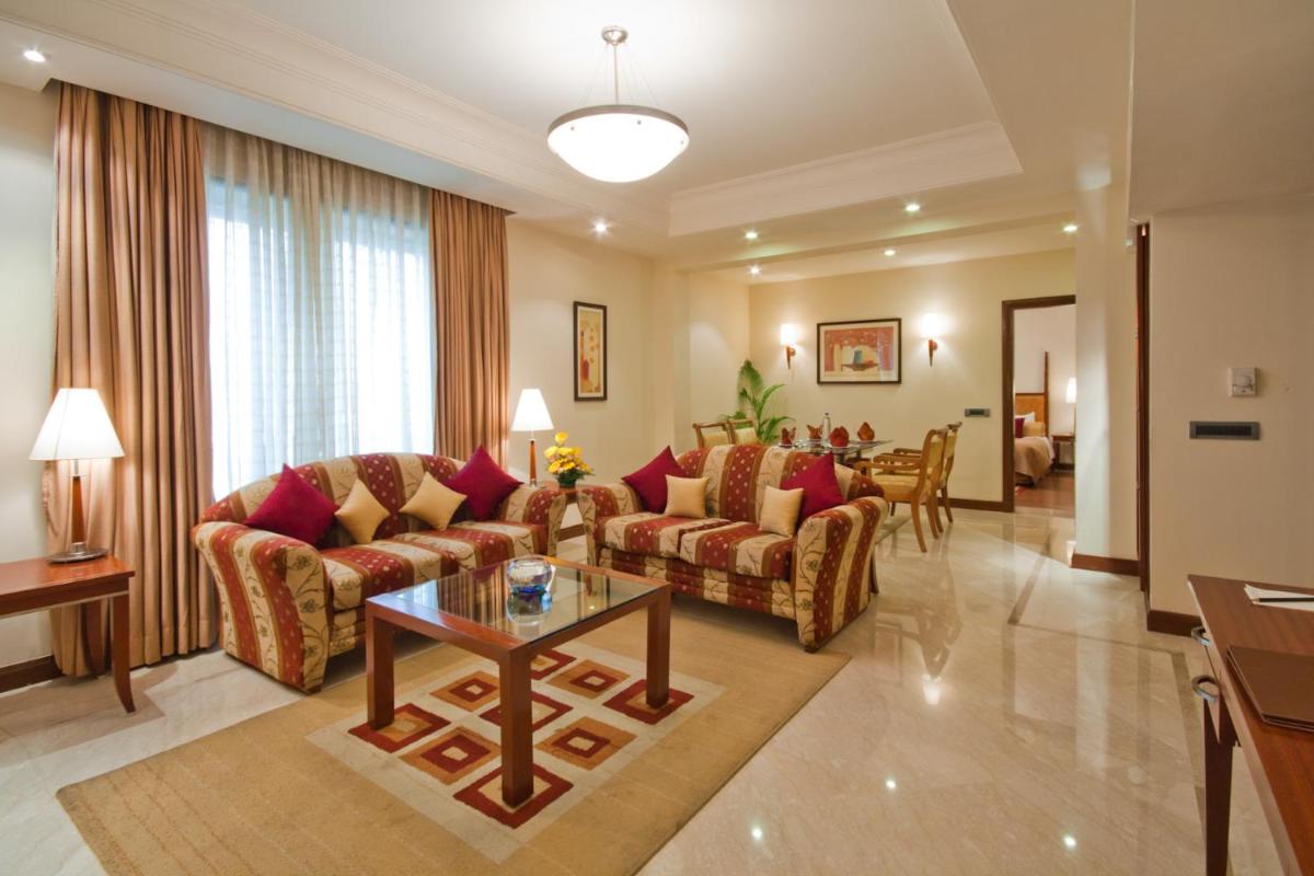 a living room with couches and a table at The Accord Metropolitan in Chennai